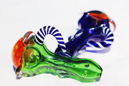 Enigmatic Monkey Glass Smoking Pipe with a Colorful Twist, showcasing green and blue hues, a compact and intricate design for an enhanced smoking experience