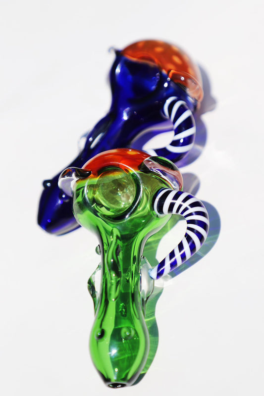 Enigmatic Monkey Glass Smoking Pipe with a Colorful Twist, showcasing green and blue hues, a compact and intricate design for an enhanced smoking experience