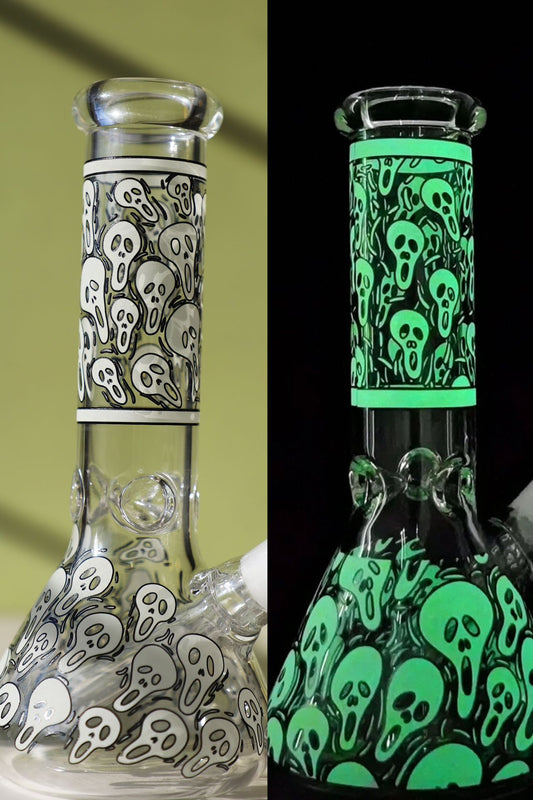 Ghostly Glow-in-the-Dark Glass Beaker Bong with Enigmatic Design, offering a Premium Smoking Experience with a Colorful Twist in Green and Blue—ideal for night-time sessions.
