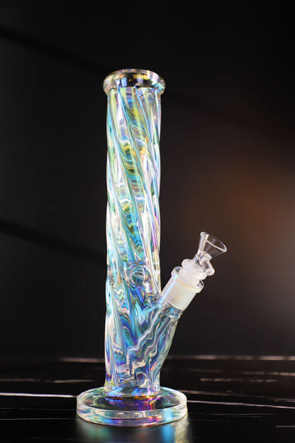 Experience a kaleidoscope of colors with this Thick, Iridescent Glass Bong. Its durable, high-quality borosilicate glass is sculpted into a Straight, Smooth-Hitting Water Pipe, an artistic smoking accessory offering both beauty and functionality. Its sleek design ensures stability for a premium, smooth hit every time. The color-changing, iridescent finish captivates with a symphony of hues, making it a unique and durable waterpipe for any collection.420
