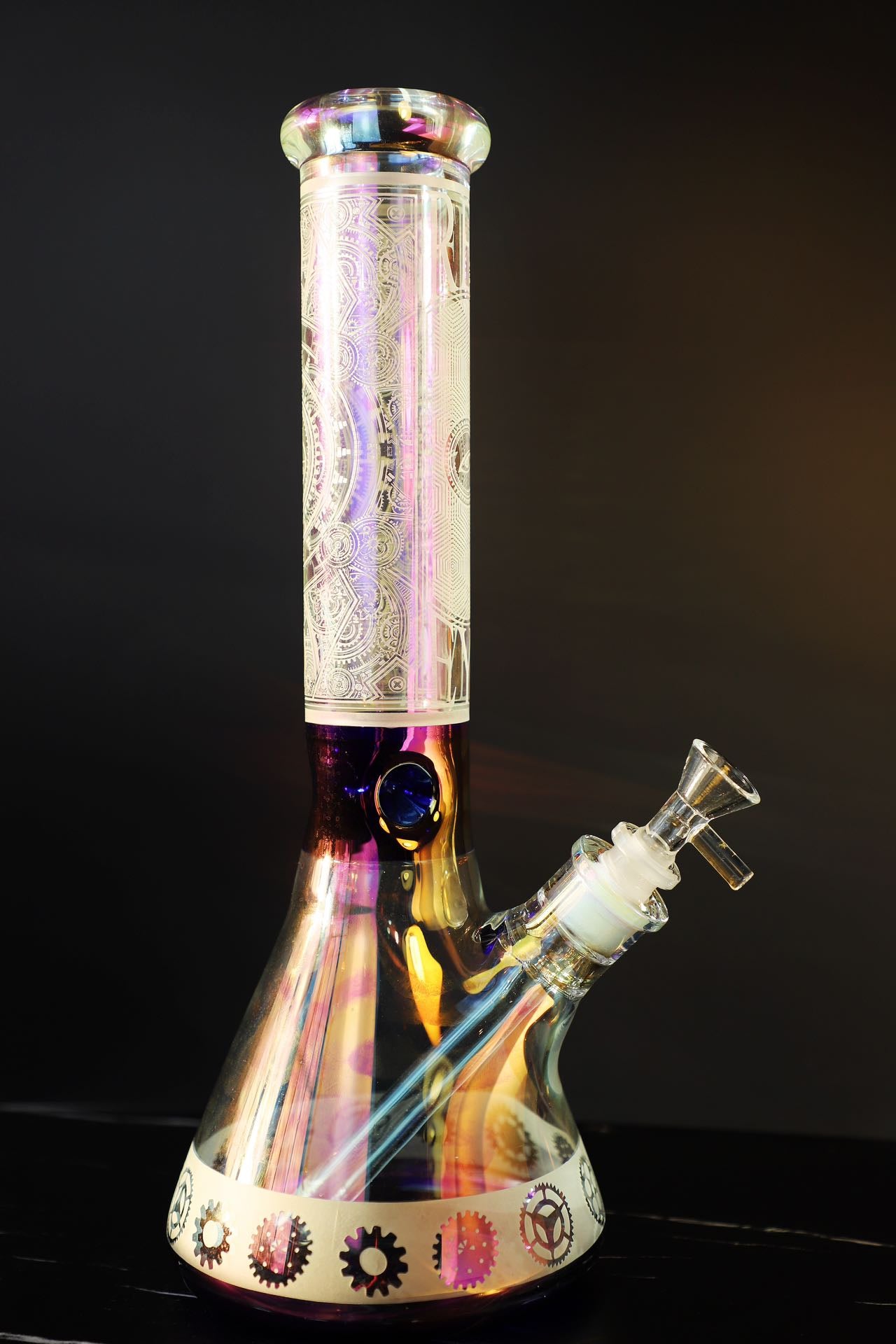 Step into sophistication with the Luxe Heavy Iridescent Glass Bong, a symbol of exquisite craftsmanship and robust elegance. This super thick glass bong shines with an iridescent play of colors, highlighting its premium build and artistic detail for a luxurious smoking experience. Perfect for collectors seeking both style and function in their smoking gear