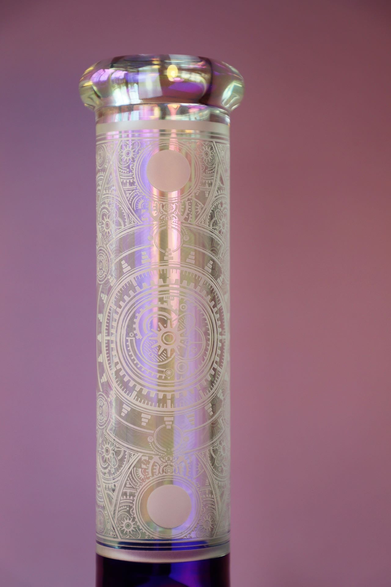 Step into sophistication with the Luxe Heavy Iridescent Glass Bong, a symbol of exquisite craftsmanship and robust elegance. This super thick glass bong shines with an iridescent play of colors, highlighting its premium build and artistic detail for a luxurious smoking experience. Perfect for collectors seeking both style and function in their smoking gear