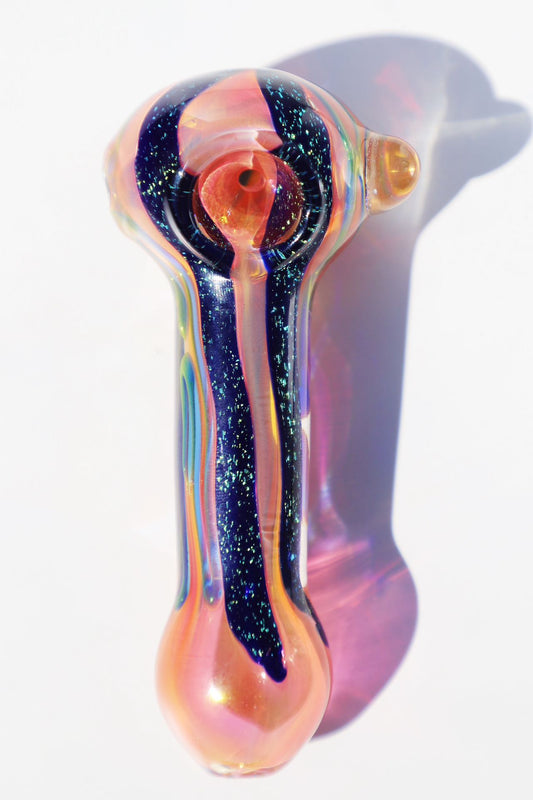Premium Handcrafted Multicolor Glass Pipe Set weighing 240g, featuring a 4 1/2” long spiral-blown glass pipe with cosmic accents. The set includes a 2” vibrant rainbow grinder, an air-tight container, a protective 5” carry box, and pipe filters for a comprehensive smoking experience. Revel in the craftsmanship and aesthetic splendor of this Glass Bowl Blown Pipe Set, complete with all essentials for convenience and style