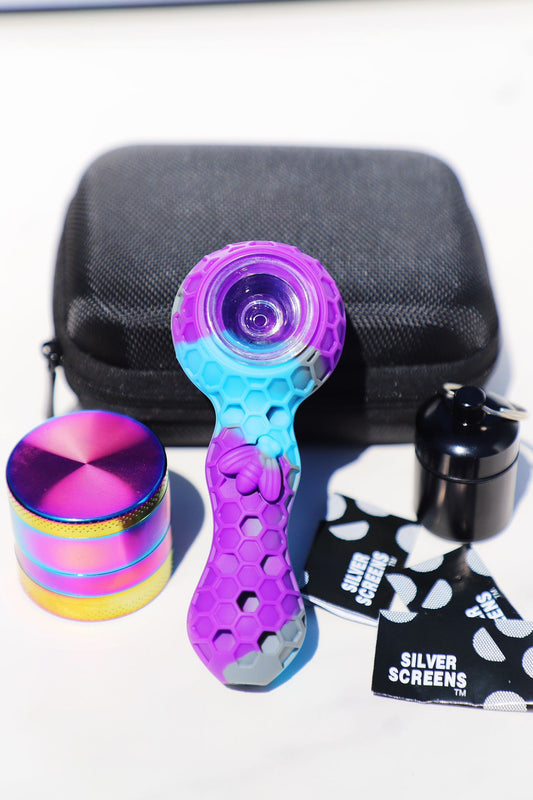 Premium Silicone Honeycomb Smoking Pipe Set with Multi-Colored Grinder and Accessories. Includes a 4.5”silicone comb pipe, a 1.75” rainbow grinder, a 2” airtight container, and a portable 5” gift box.The vibrant purple and blue colors paired with a high-quality quartz glass bowl make this pipe set not only practical but also a stylish addition to any smoker’s collection. Available for outdoor and travel use