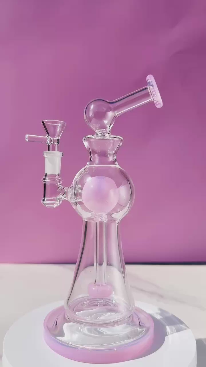 Enchanted Garden Mini Bong, the Ultimate Girly Glass Piece for Sophisticated Smokers with purple, pink, and green accents, offering an Ultimate Smooth Experience with Curve Percolator Bong, Green Glass Bong, and Advanced Filtration for a Sophisticated Smoking Session.