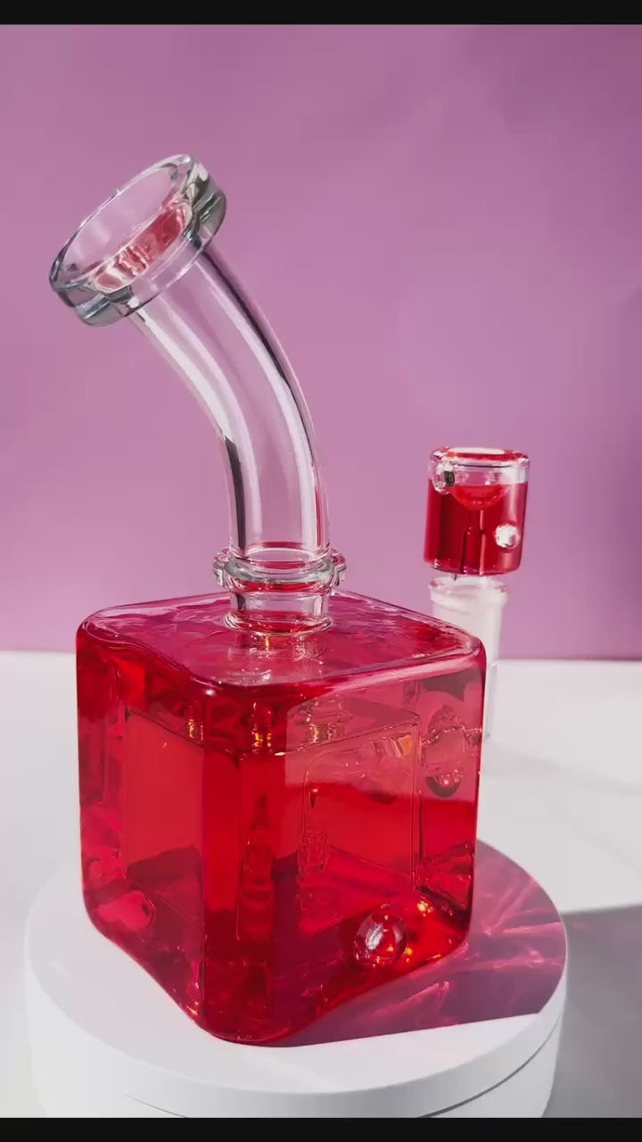 Unleash a frost-enhanced smoking experience with the Smooth Chill Glycerin Coil Bong collection. Featuring elegant glassware in vibrant red, purple, and green, these square-base, bent-neck bongs with ice catchers offer a modern smoke piece design for a sleek and sophisticated session